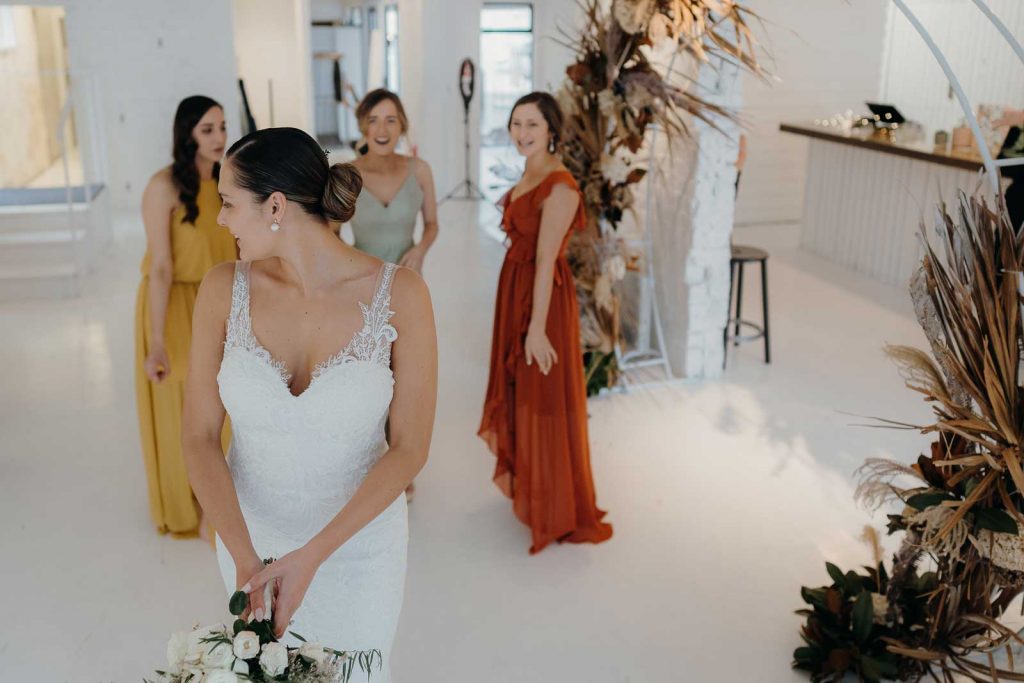 Brides throwing bouquet