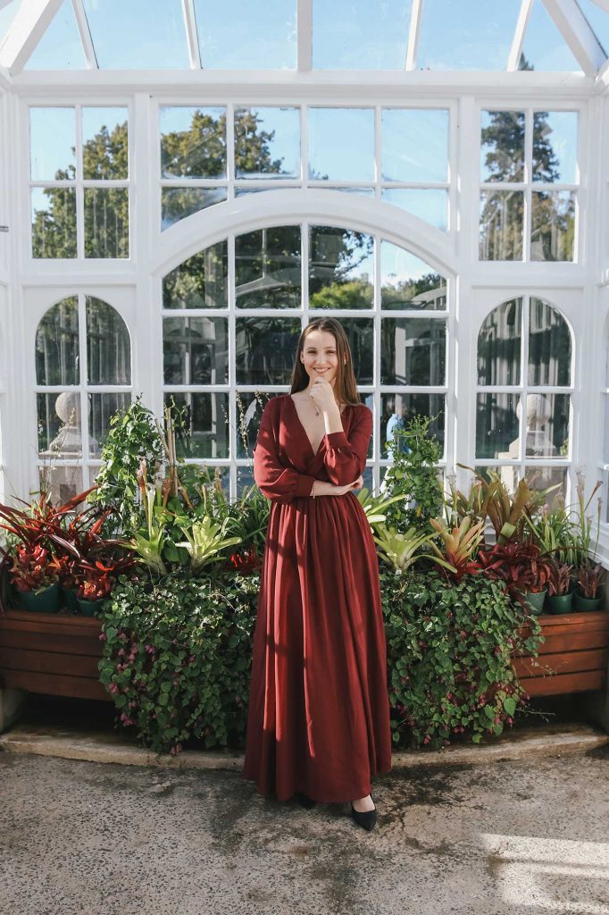Standing in glass house with Esther dress