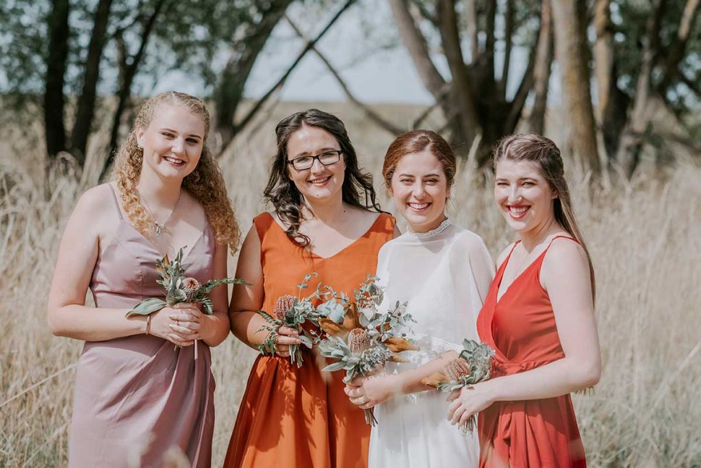 <strong>Featuring:</strong> Claudia dress in Claret, Diana dress in Dusty Purple and Lola dress in Burnt Orange 