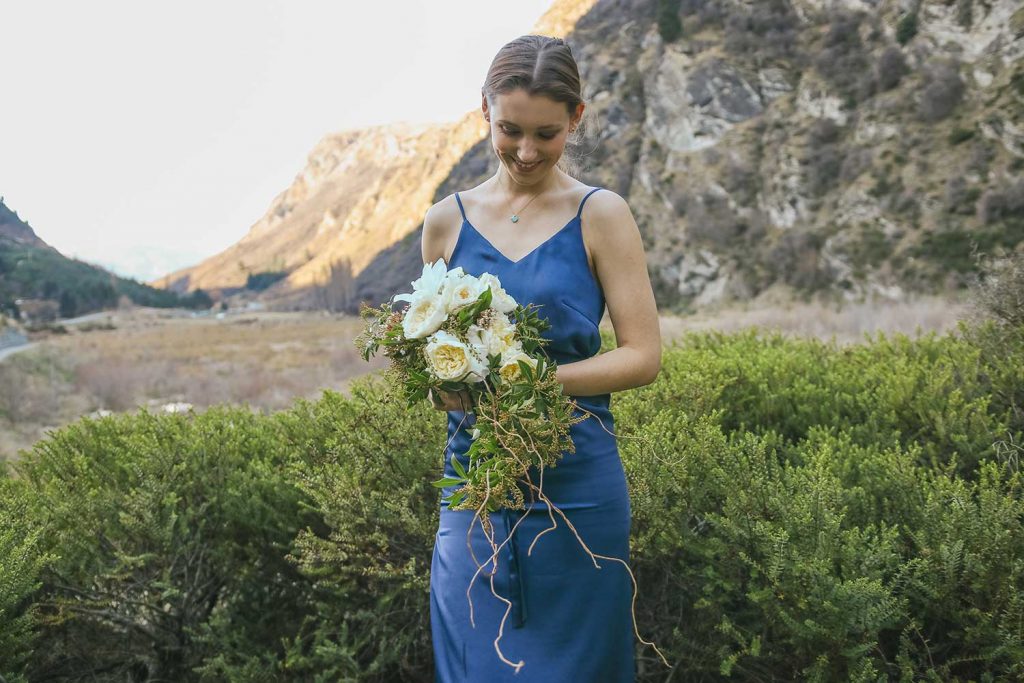 <strong>Featuring:</strong> Nadia Satin Midi Dress in Navy