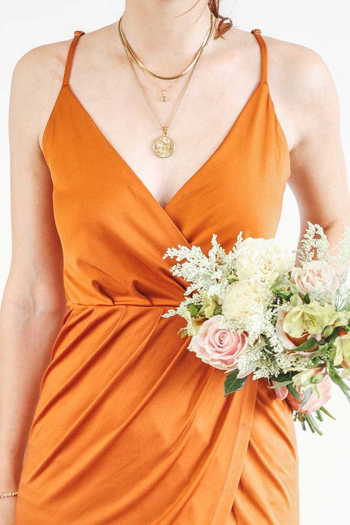 <strong>Featuring:</strong> Claudia high low dress in Burnt Orange